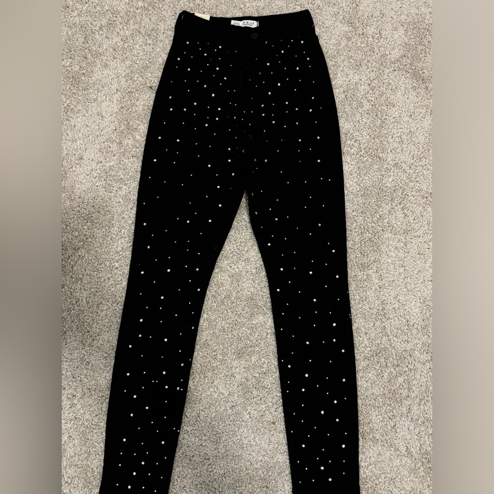 AP Blue rhinestone black pants.